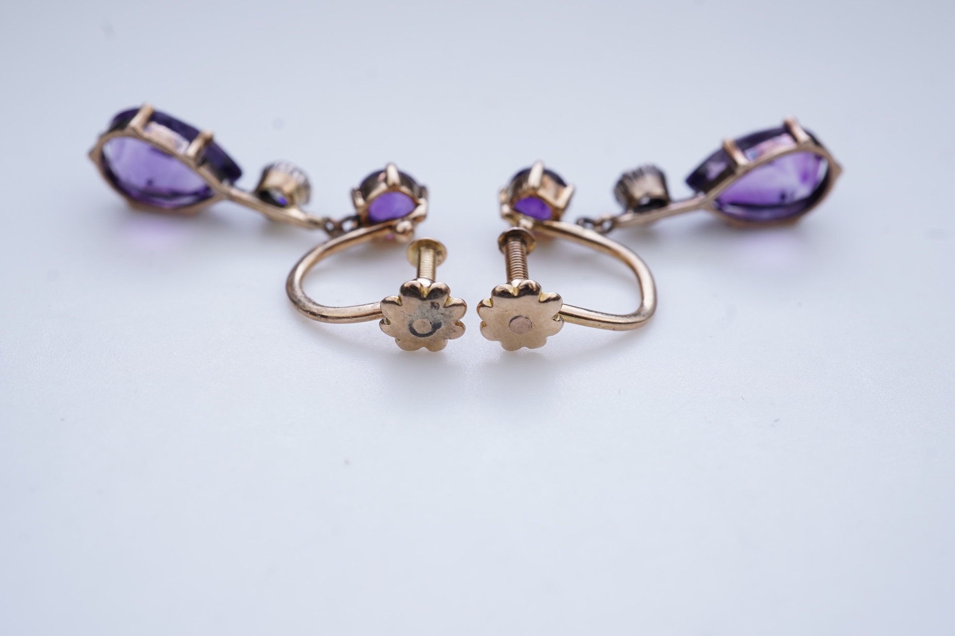 A pair of amethyst and diamond earrings, early 20th century